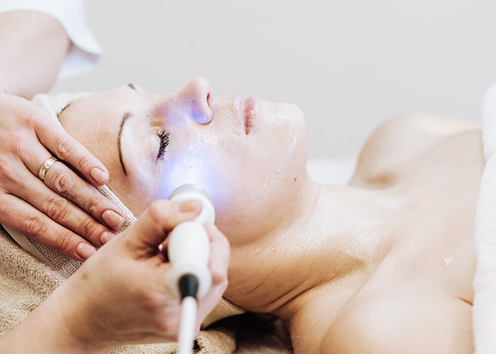 woman getting laser treatment.
